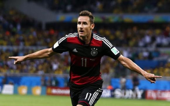 Germany's Miroslav Klose scores a goal during the 2014 World Cup semi-finals between Brazil and Germany at the Mineirao stadium