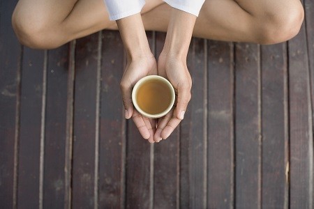 Woman's hands holding tea