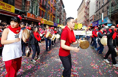 NEW YORK CITY - FEBRUARY 2 2014: Chinese Lunar New Year, the Year of the Horse, was celebrated by a parade in Manhattan's Chinatown. Dancers with percussion player along Mott Street.; Shutterstock ID 174715979; Project/Title: World's Biggest Chinese New Year Celebrations; Downloader: Fodor's Travel
