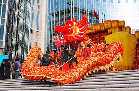 BEIJING - FEB 11: participants perform the dragon and lion dance during Chinese Spring Festival (Chinese New Year) on February 11, 2013 in Beijing, China. The dance is meant to evict evil spirits.; Shutterstock ID 128657354; Project/Title: World's Biggest Chinese New Year Celebrations; Downloader: Fodor's Travel